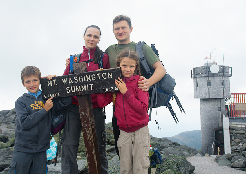 two children and two adults family at Mt. Washington summit
